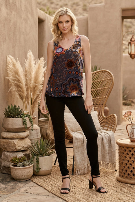 Woman wearing a sleeveless tank top with colorful burnout velvet pattern from Johnny Was