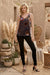 Woman wearing a sleeveless tank top with colorful burnout velvet pattern from Johnny Was