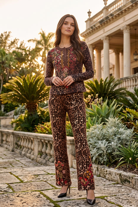 Woman wearing leopard printed henley top with colorful florals and long sleeves from Johnny Was
