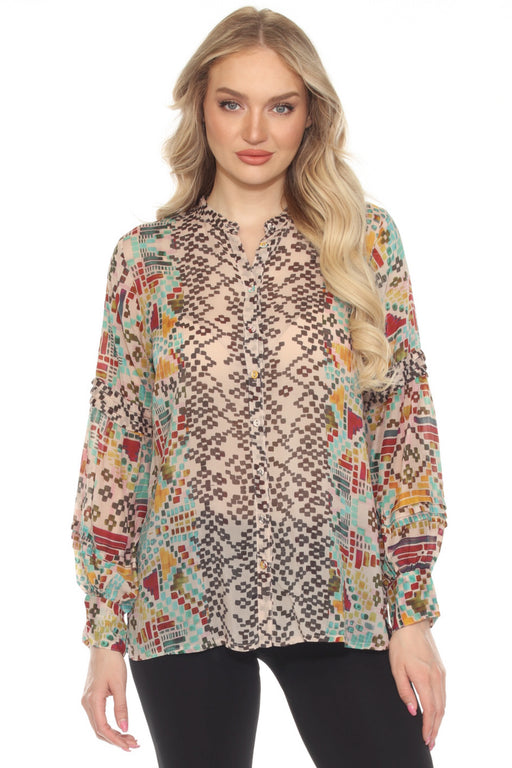 Woman wearing a geometric patterned blouse with long sleeves and button down closure