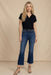 Woman wearing a blue cropped boot jeans with raw hem from Johnny Was