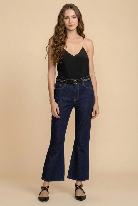 Woman wearing a bootcut dark blue jeans from Johnny Was