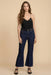 Woman wearing a bootcut dark blue jeans from Johnny Was