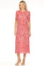 Woman wearing a pink midi mesh dres with floral print and half sleeves from Johnny Was