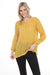 Woman wearing a yellow tunic top with tonal embroidery and bishop sleeves from Johnny Was