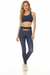 Woman wearing a navy high waist legging with contrast floral waistband trim from Johnny Was