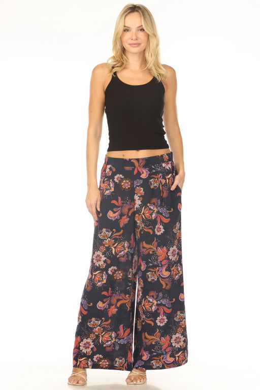 Woman wearing a floral wide leg pant with elastic waistband and side pockets from Johnny Was