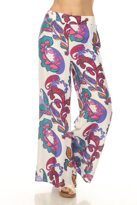 Woman wearing a vibrant paisley-patterned flared pant with pull on waistband from Johnny Was
