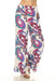 Woman wearing a vibrant paisley-patterned flared pant with pull on waistband from Johnny Was