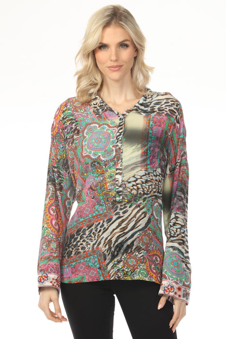 Woman wearing a colorful patterned long sleeve top with paisley and animal prints from Johnny Was