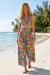 Woman wearing a colorful floral printed high waist cropped wide leg pants from Johnny Was