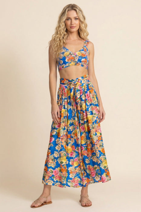 Woman wearing a colorful floral printed high waist cropped wide leg pants from Johnny Was
