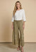Woman wearing a green wide leg embroidered pants with smocked waist from Johnny Was