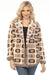 Woman wearing a knitted jacket with granny square patterns and flower beads from Johnny Was