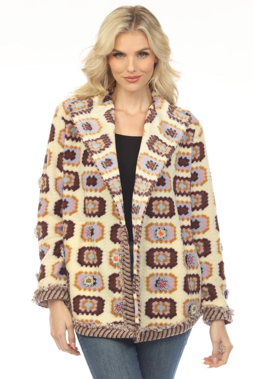 Woman wearing a knitted jacket with granny square patterns and flower beads from Johnny Was