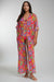 Woman wearing a colorful floral maxi kimono swimsuit cover-up from Johnny Was