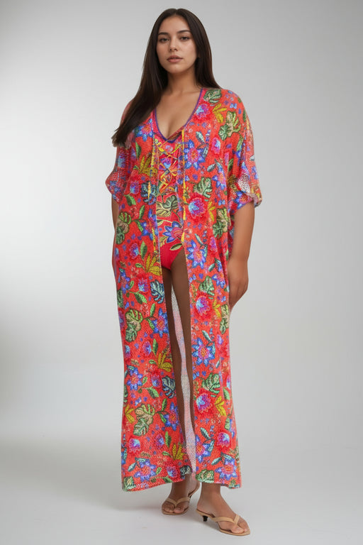 Woman wearing a colorful floral maxi kimono swimsuit cover-up from Johnny Was