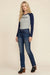 Woman wearing a medium blue straight leg jeans from Johnny Was