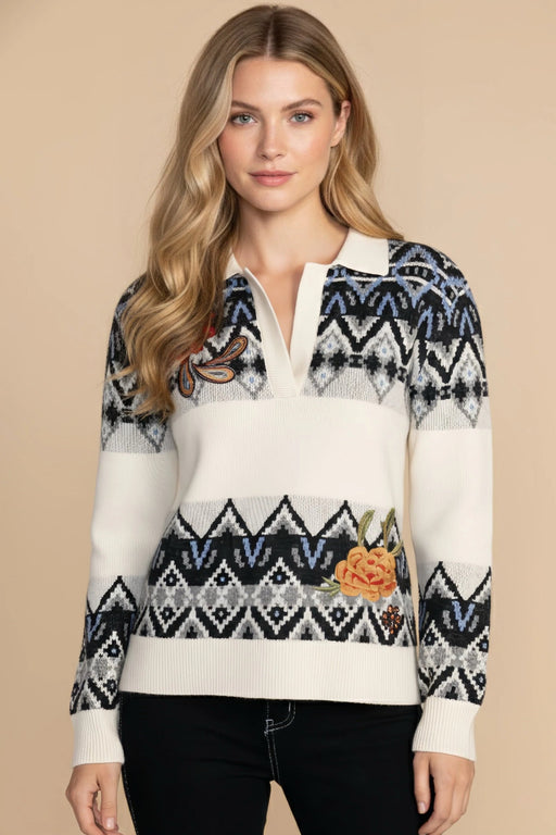 Woman wearing a Fair isle patterned pullover polo sweater with floral embroidery from Johnny Was
