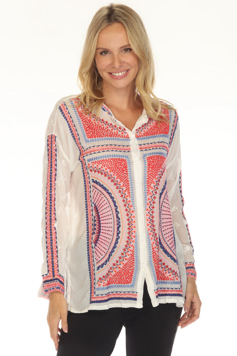 Woman wearing a white shirt with colorful patterned embroidery and long sleeves from Johnny Was