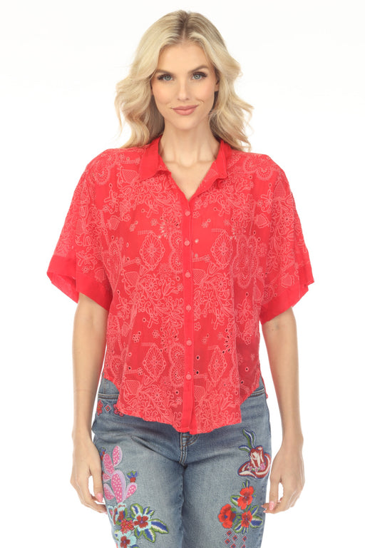 Woman wearing a red embroidered shirt with button front and curved hem from Johnny Was