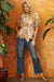Woman wearing a denim blue jean with ankle length straight leg, braided outseam, and frayed hem from Johnny Was