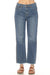 Woman wearing a denim blue jean with ankle length straight leg, braided outseam, and frayed hem from Johnny Was