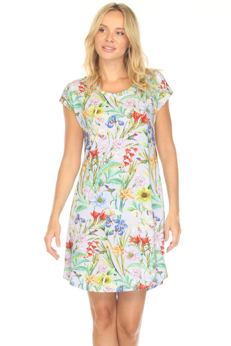 Woman wearing a colorful floral sleep dress with cap sleeves from Johnny Was
