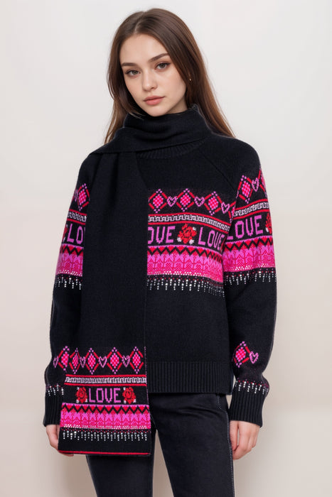 Woman wearing a black sweater and scarf with love and pink and red fair isle pattern