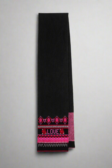 Black scarf with pink and red pattern and 'LOVE' text on a white background