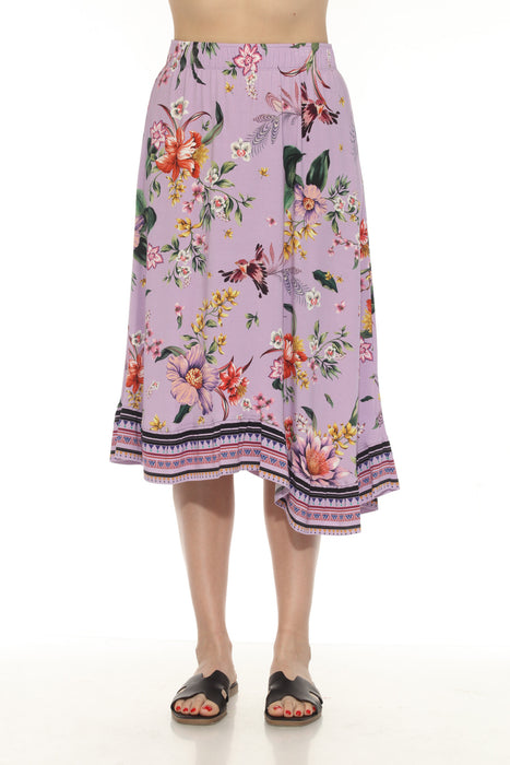 Woman wearing a colorful floral printed midi asymmetric hem skirt
