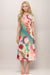 Woman wearing a colorful floral midi dress with crew neck and short sleeves from Johnny Was
