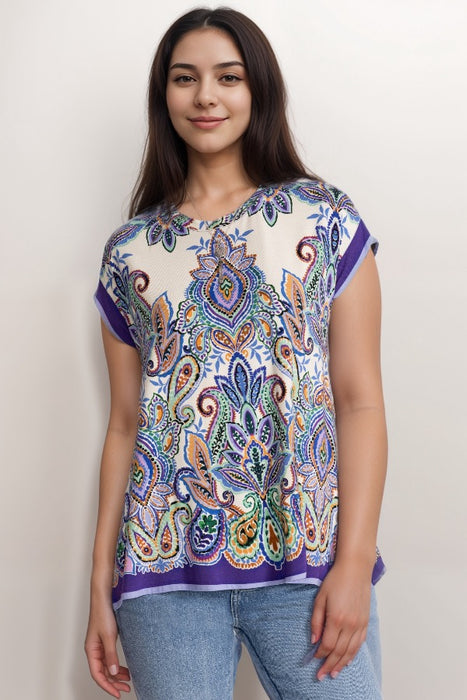 Woman wearing a colorful paisley patterned t-shirt with crew neck and short sleeves
