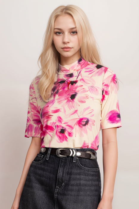 Woman wearing a top with bold florals in shades of purple