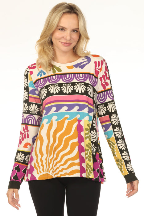 Woman wearing a colorful patterned t-shirt with crew neck and long sleeves from Johnny Was