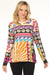 Woman wearing a colorful patterned t-shirt with crew neck and long sleeves from Johnny Was