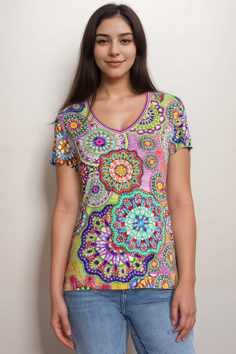 Woman wearing a colorful patterned t-shirt with v-neck