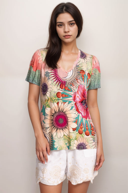 Woman wearing a colorful floral t-shirt with v-neck and puff sleeves from Johnny Was