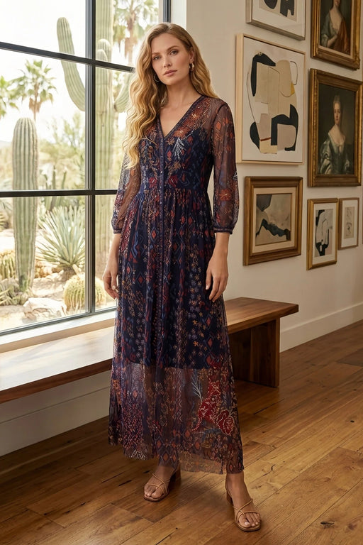 Woman wearing a printed and embroidered mesh maxi dress with v-neck and 3/4 bishop sleeves from Johnny Was