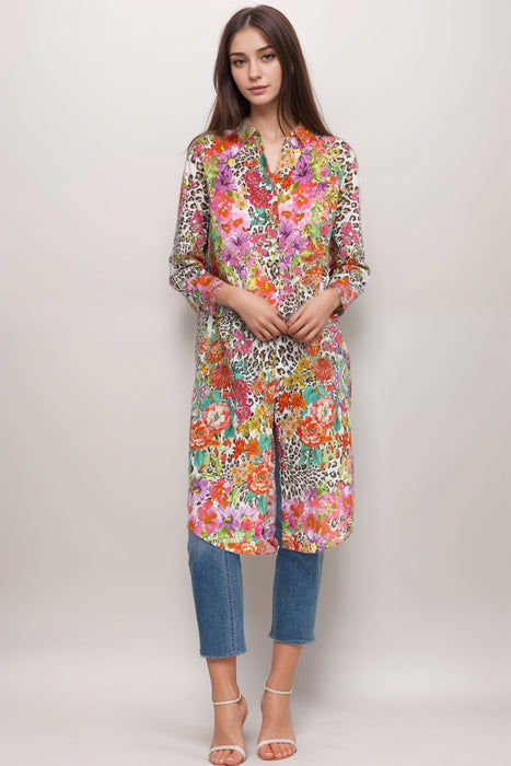 Woman wearing a colorful printed dress with mix of floral and animal pattern from Johnny Was