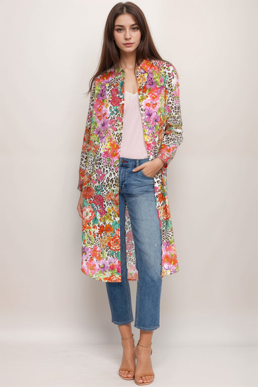 Woman wearing a colorful printed dress with mix of floral and animal pattern from Johnny Was