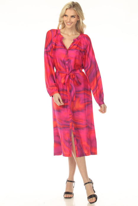 Woman wearing a vibrant pink tie-dye patterned midi dress with belt and button front from Johnny Was