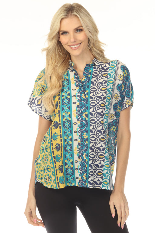 Woman wearing a colorful patterned shirt with dolman sleeves and button front from Johnny Was