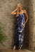 Woman wearing a blue floral maxi slip dress with scoop neck and spaghetti straps from Johnny Was