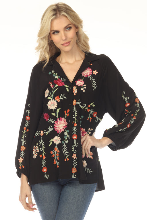 Woman wearing a black floral embroidered silk shirt with raglan puff sleeves from Johnny Was
