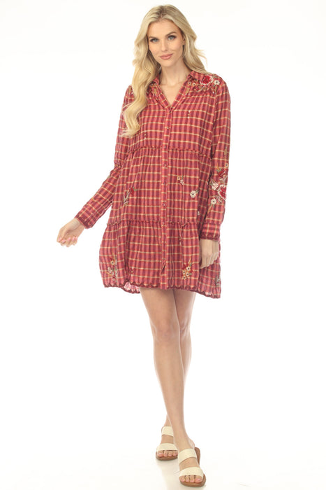 Woman wearing a red plaid tiered dress with floral embroidery from Johnny Was