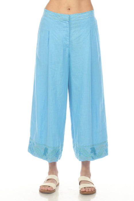 Woman wearing a blue linen culotte pant with embroidered crop hem from Johnny Was