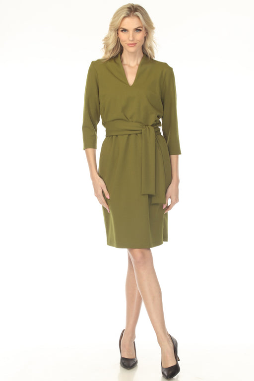 Woman wearing a green dress with a self-tie belt and 3/4 sleeves from Joseph Ribkoff