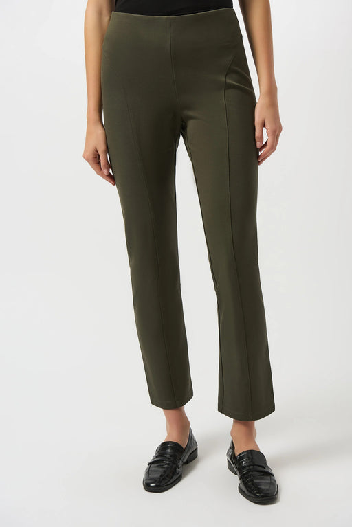 Woman wearing a green pull on slim ankle pant