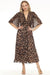 Woman wearing a leopard print pleated chiffon fit and flare dress